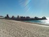 Dump trucks on pier (Small).jpg